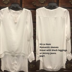 Hi-lo hem, light perfect white dressy top!